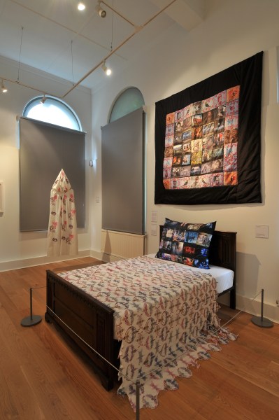 'Red Riding Hood's Cloak', The Mercer Art Gallery, 2013 next to my Grandmother's bed and 'The Woodcutter's Quilt'
