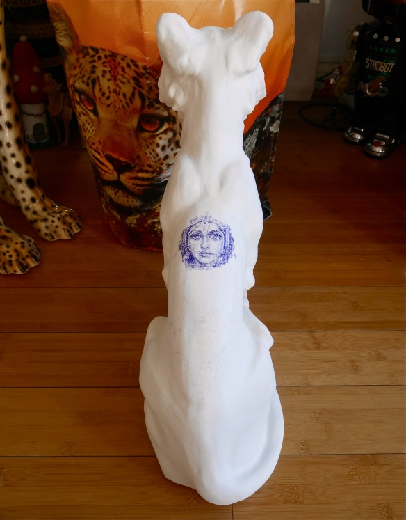 Overall view of tiger sculpture back and beginnings of tattoo drawing