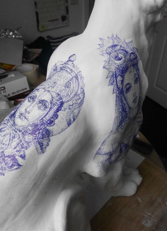 Vishnu and Lakshmi blue Biro tattoos on Tiger Sculpture